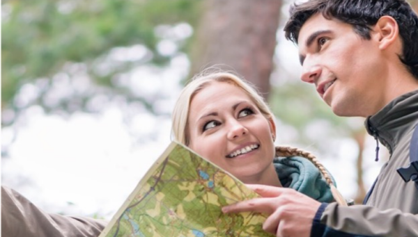 Woman shows man map and direction
